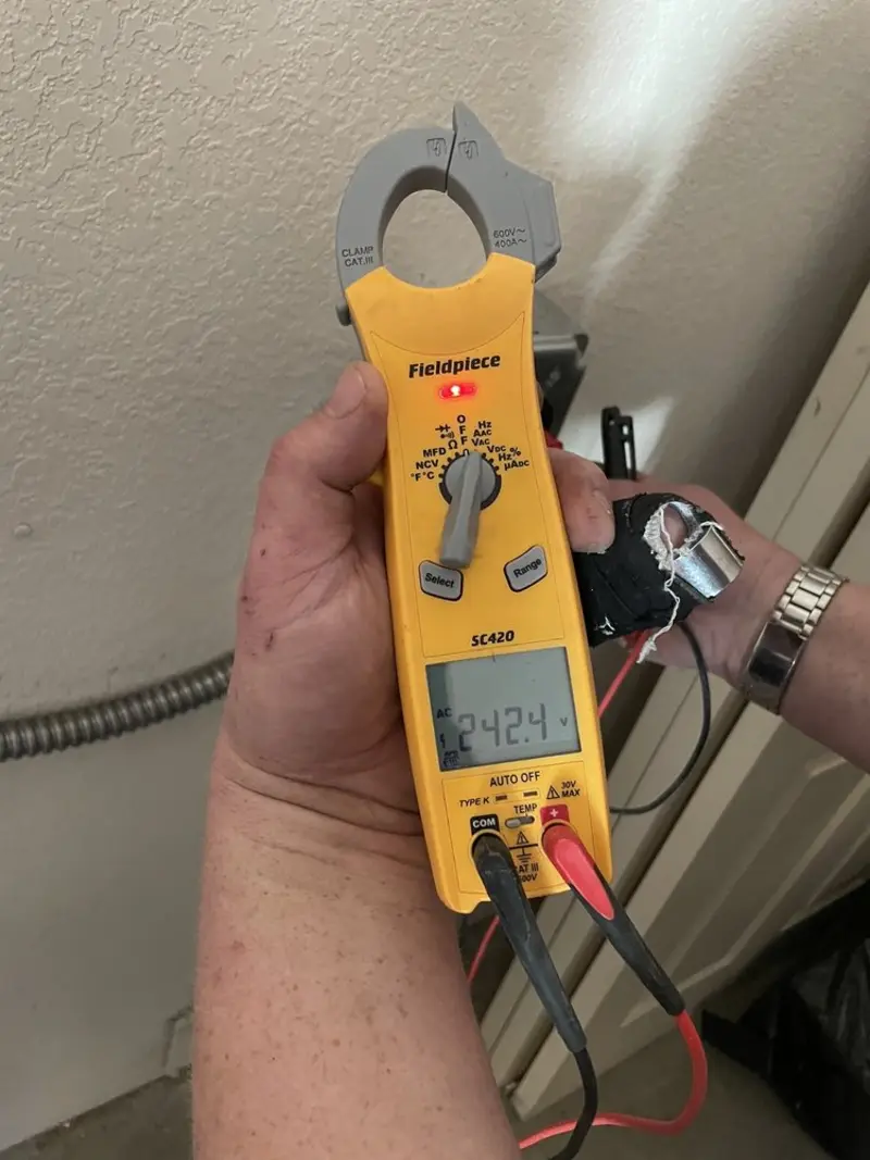 Voltage testing with clamp meter during Whole House Surge Protector in Rocky Hill